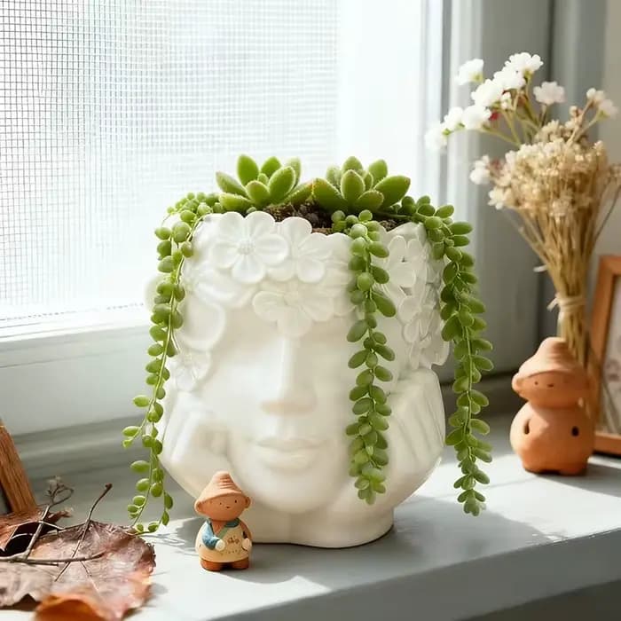 Magnifique pot de fleurs en résine en forme de fille tenant une fleur