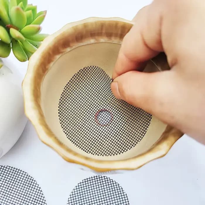 Grille de tampon en maille pour trou de Pot