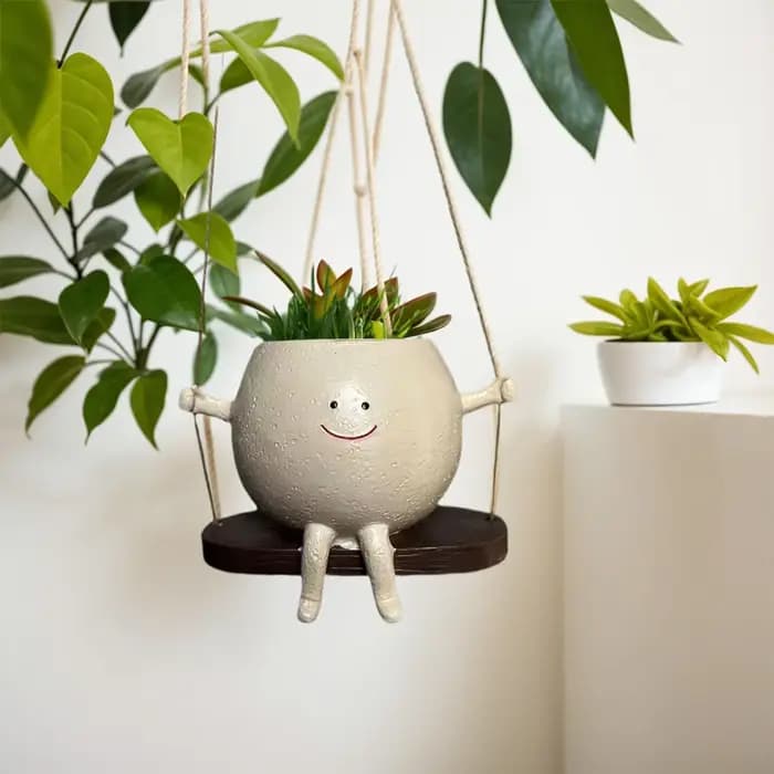 Jardinière de visage de sourire de chaise/balançoire